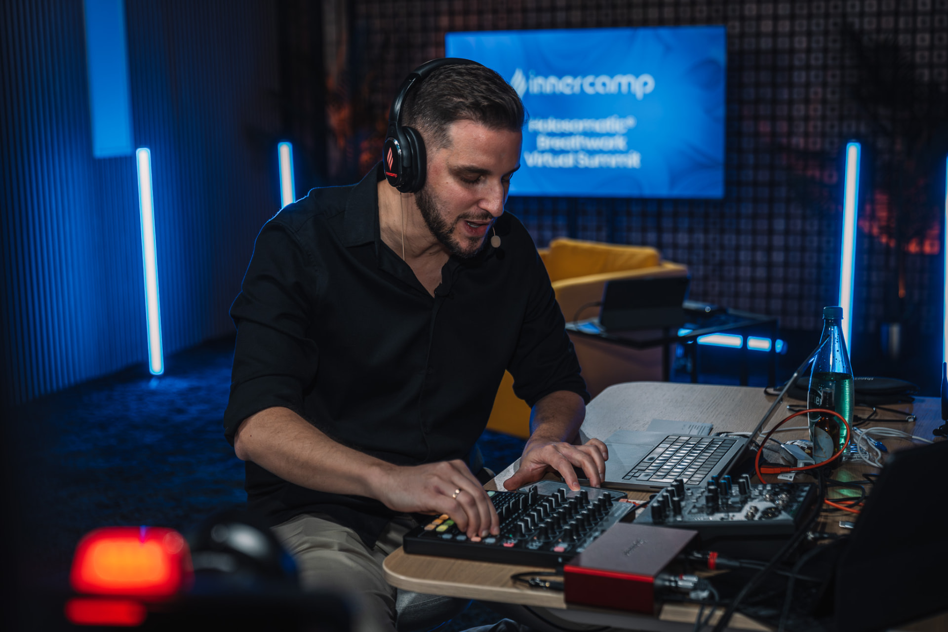 Alexis Alcalá mixing music live during a Holosomatic® Breathwork Virtual Summit