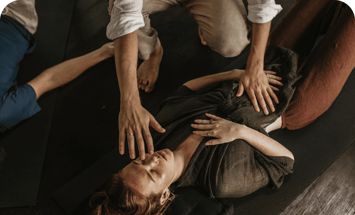 Hands-on somatic therapy session using gentle touch and body awareness to support emotional release and grounding