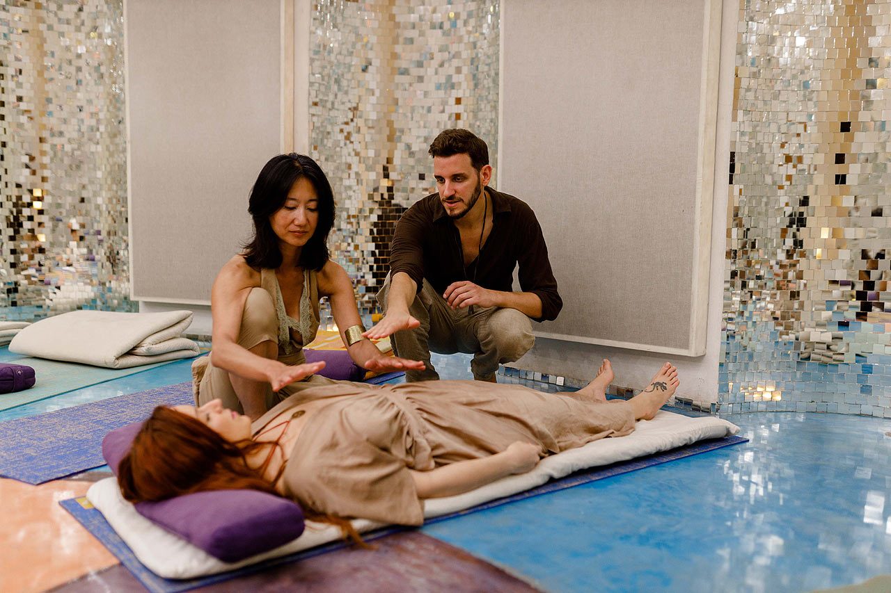 Facilitators giving hands-on bodywork support