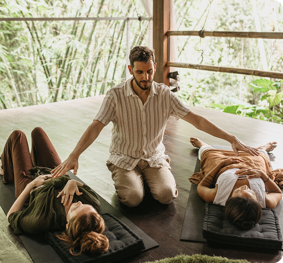 Certified energy healer facilitating a group workshop focused on nervous system regulation