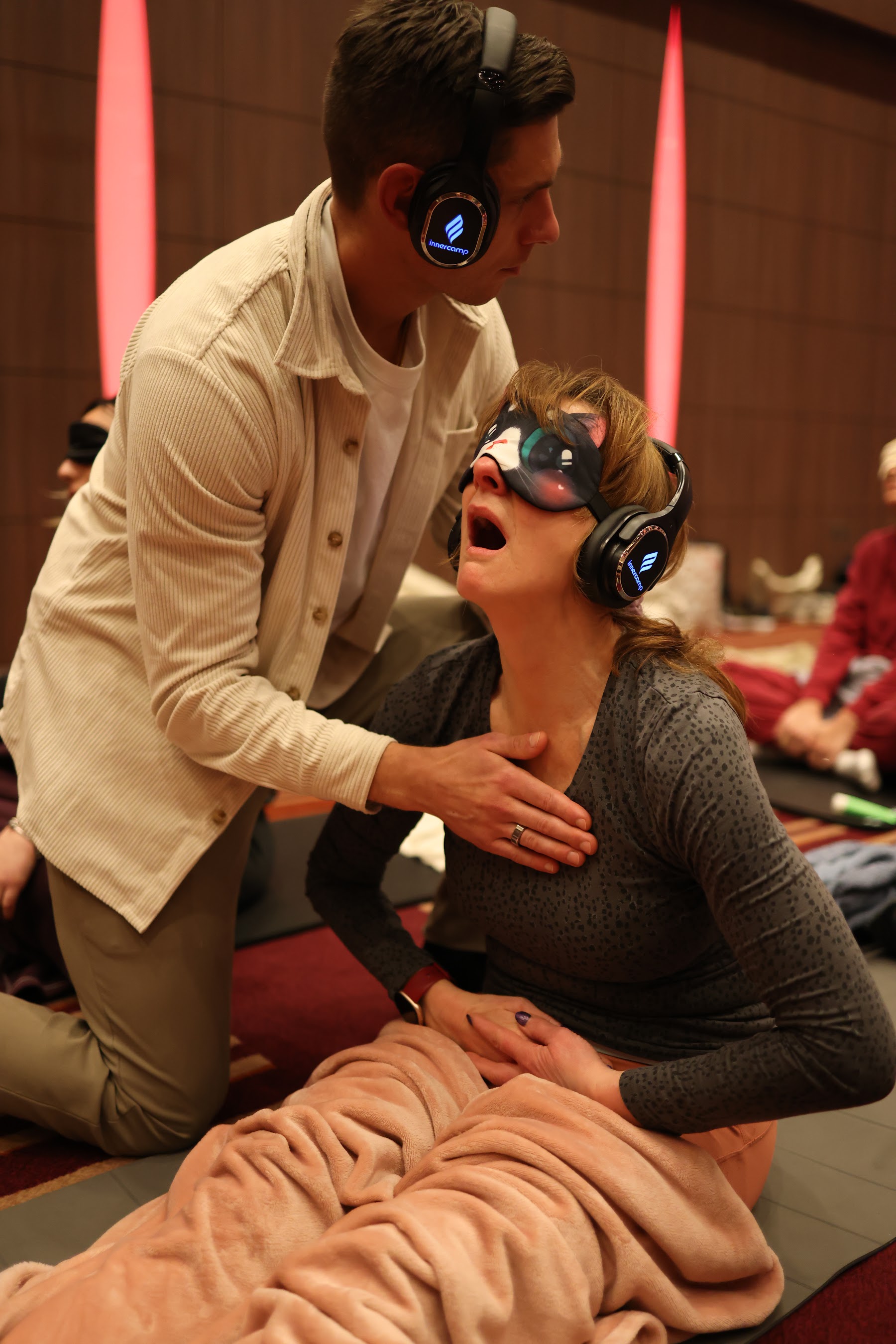 A facilitator supporting a participant during a session