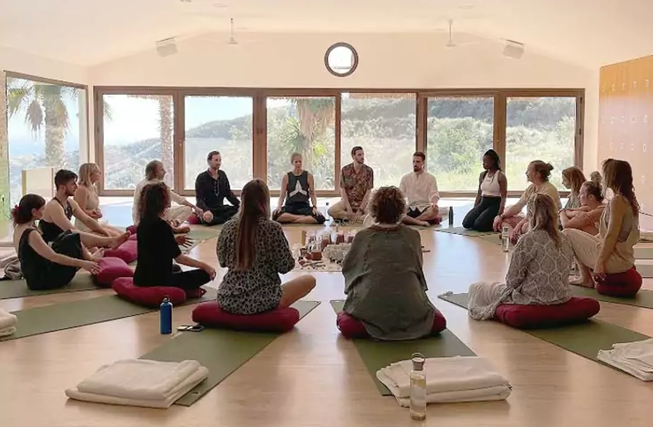 Somatic healing group seated in a calm studio, exploring body awareness, nervous system regulation and connection