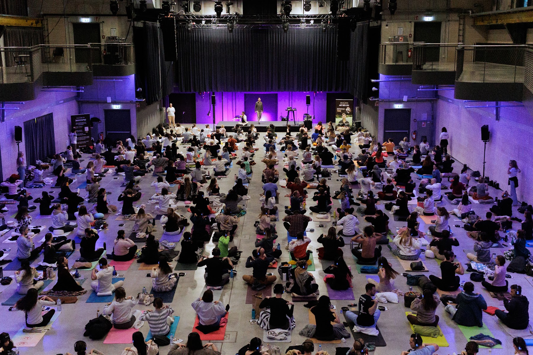 Group session in a purple-lit hall