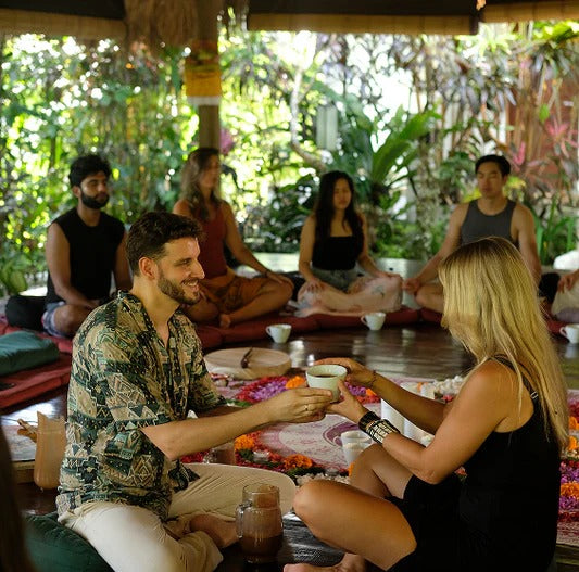 Group facilitation led by a certified holistic practitioner in a structured circle supporting community and awareness.