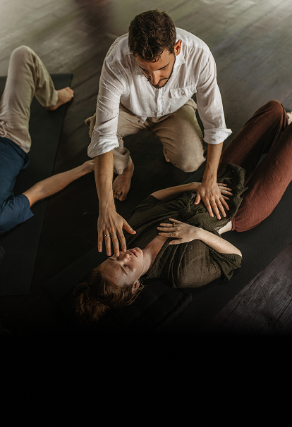 Founder Alexis facilitating a somatic breathwork session, supporting nervous system regulation through trauma-informed practice.